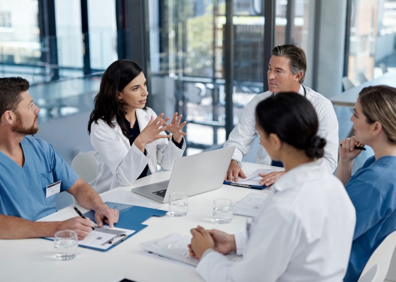 Doctors having a discussion at table